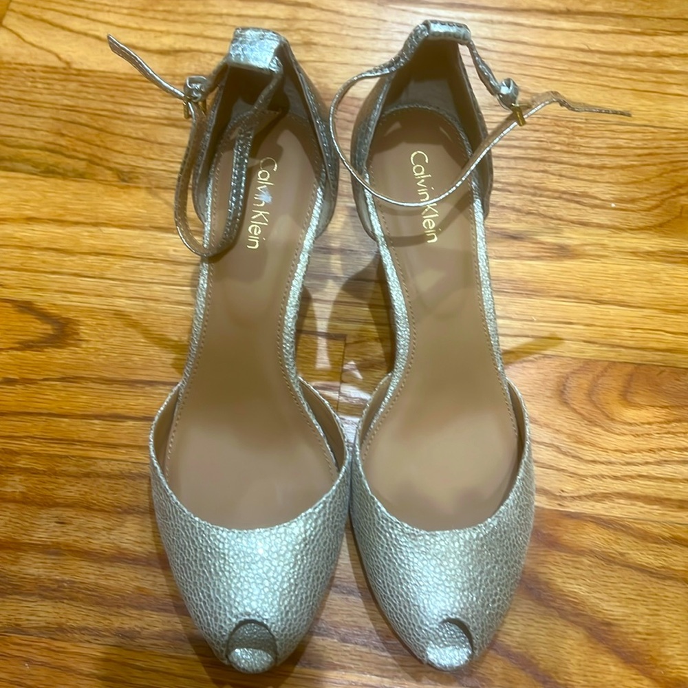 The Calvin Klein Saiden Silver/Snake Print Open Toe Heeled size 9. 3.5 high